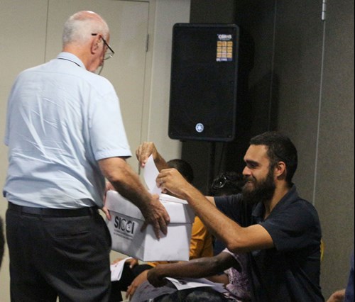 Members casting their votes.